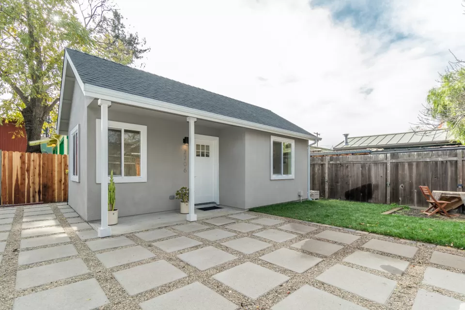 Small grey accessory dwelling unit cottage in California backyard